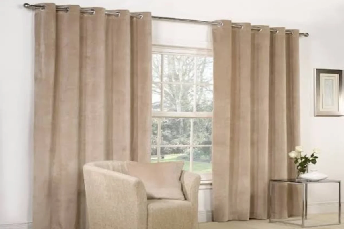 Professional installation of customized beige curtains in Dubai homes