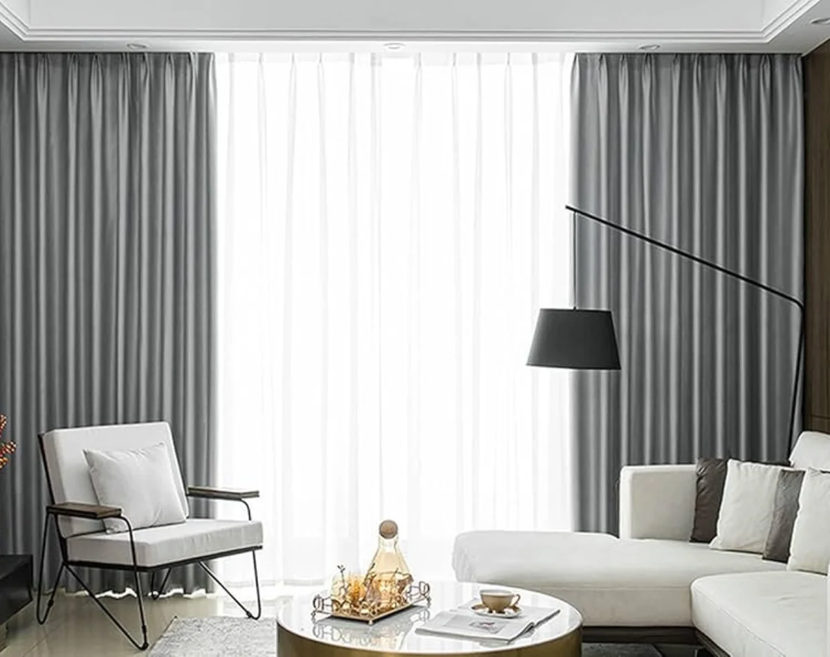 Grey curtains with sheer layer in modern living room Dubai