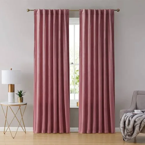 Blush pink drapes hanging in stylish bedroom setting Dubai