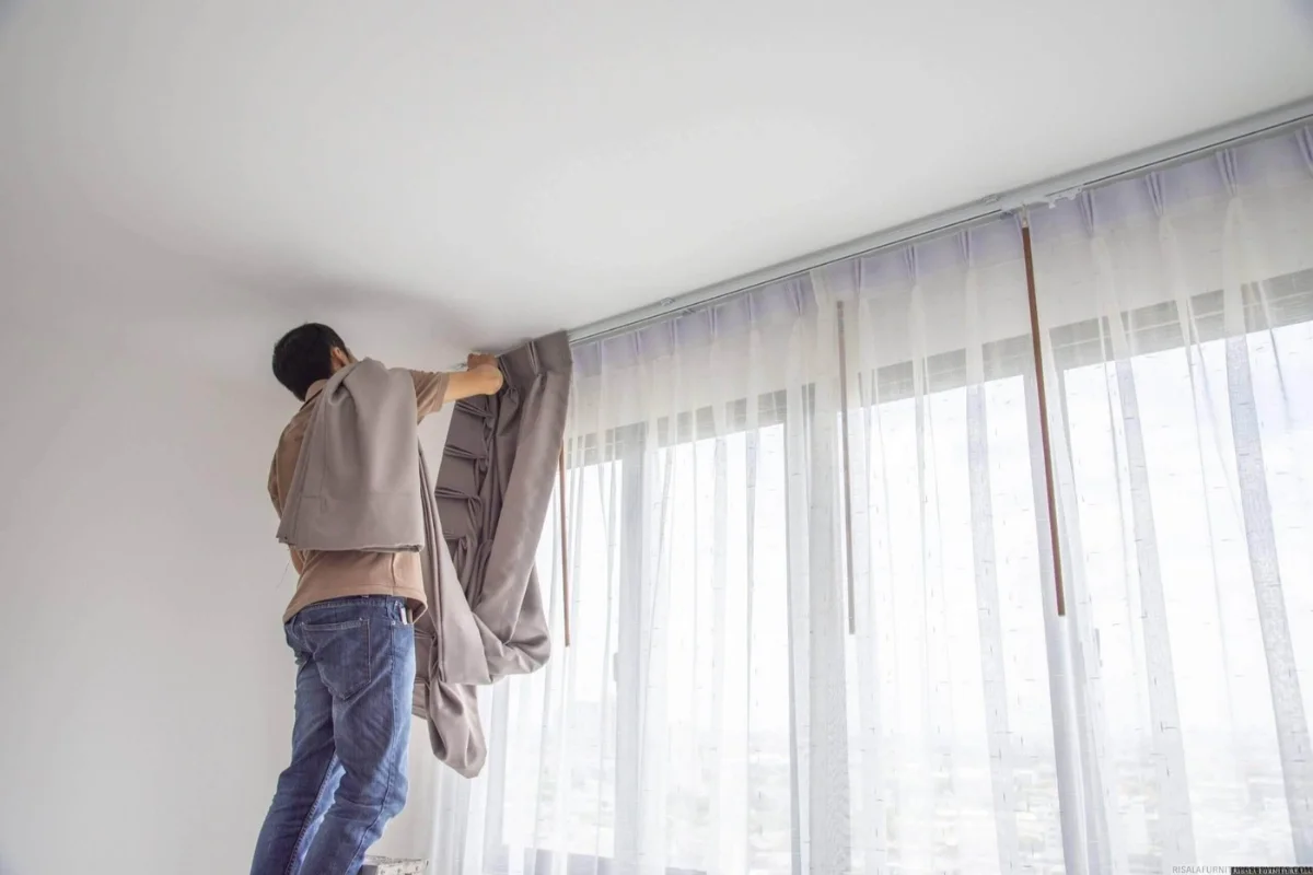 Professional curtain installation worker Dubai