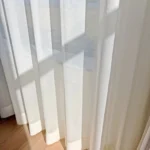 Sheer curtain fabric close-up shimmer texture