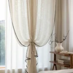 Sheer curtain filtering warm soft light