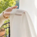 White sheer curtain diffused sunlight window
